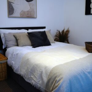 A cozy minimalist bedroom featuring elegant decor
